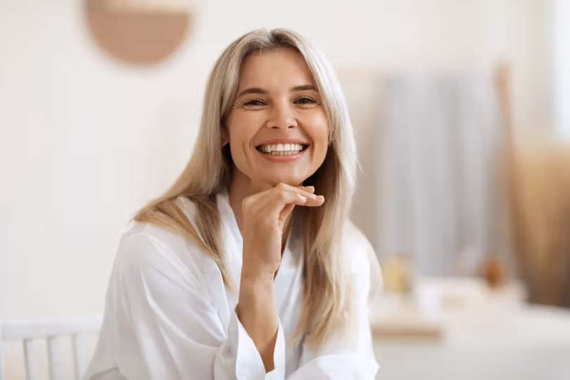 Woman smiling in a bright room