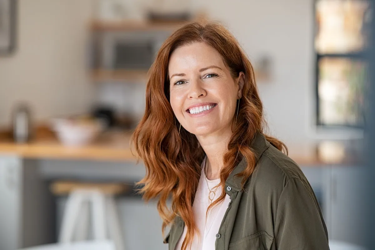 Woman smiling after restorative dental care