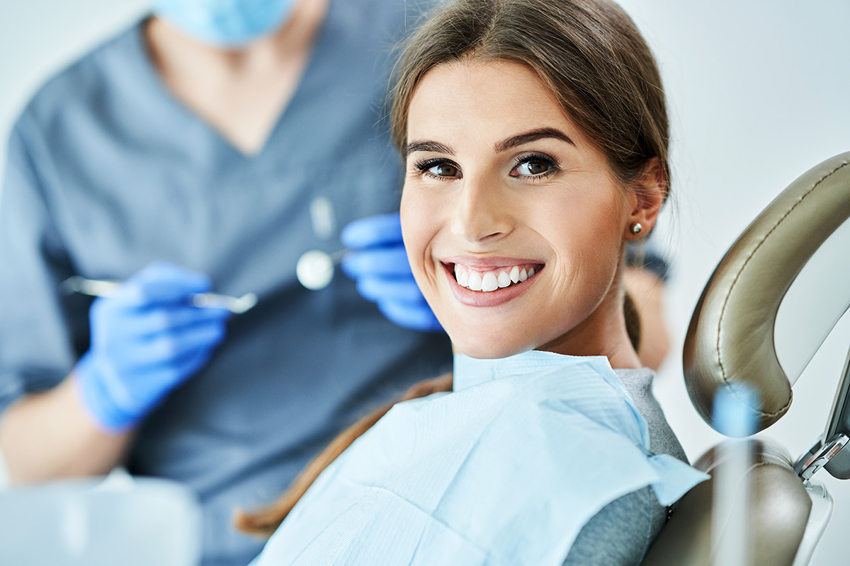 Patient smiling during a dental examination